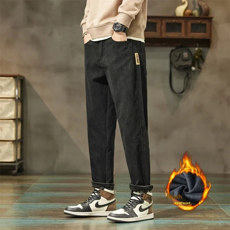 Men's corduroy casual trousers in tapered straight-leg style with mid waist and zipper fly closure