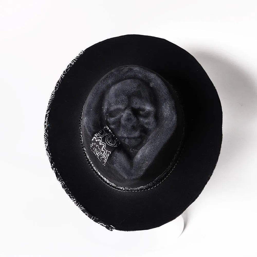 Handmade wool felt skull hat with a conical crown and blue denim trim.