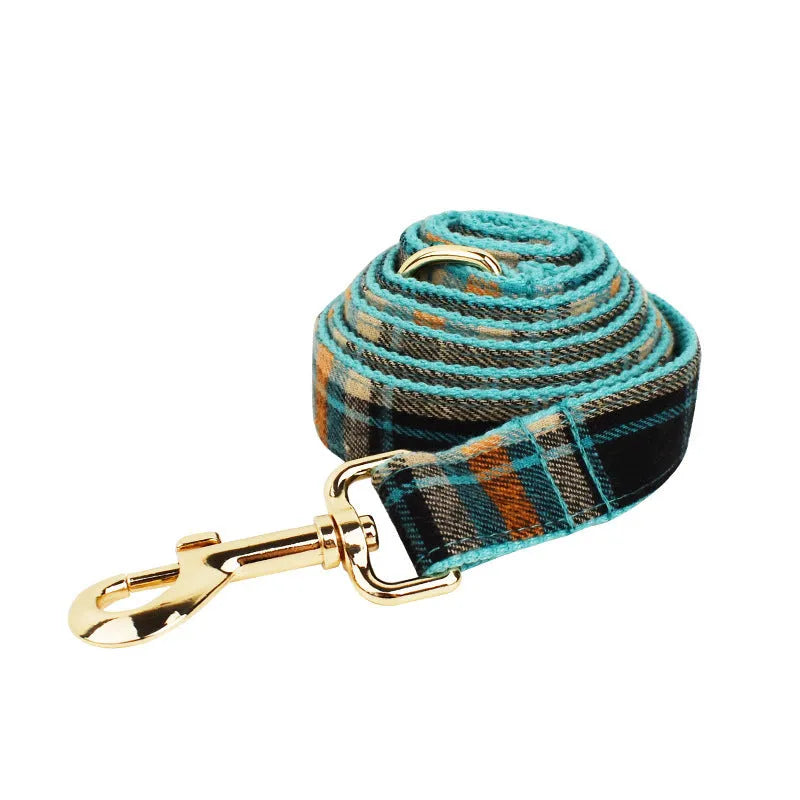 Retro green cloth dog collar leash set with matching vest and bow tie on white background