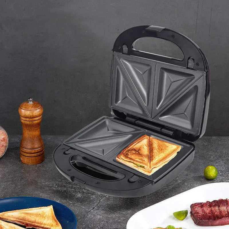 Black electric sandwich pan with brushed stainless steel top cover showing non-stick cooking surface