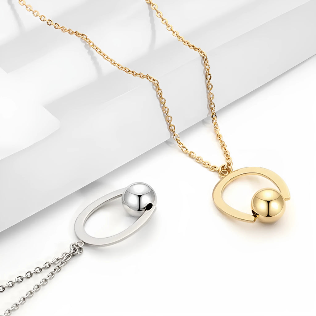Adjustable stainless steel necklace with a geometric pendant in a gold electroplated finish.