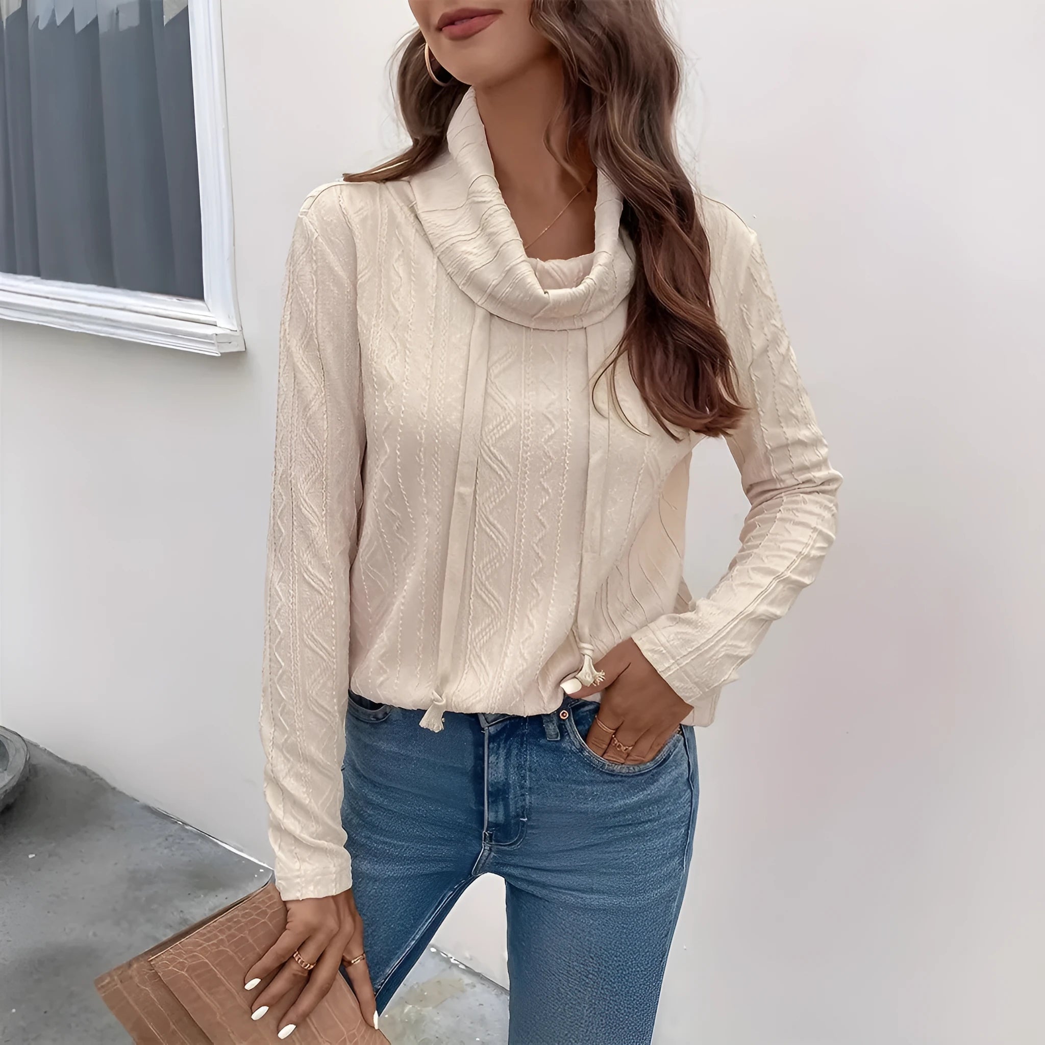 Apricot hooded pullover sweater with long sleeves on hanger