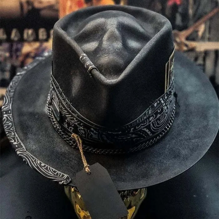 Handmade wool felt skull hat with a conical crown and blue denim trim.
