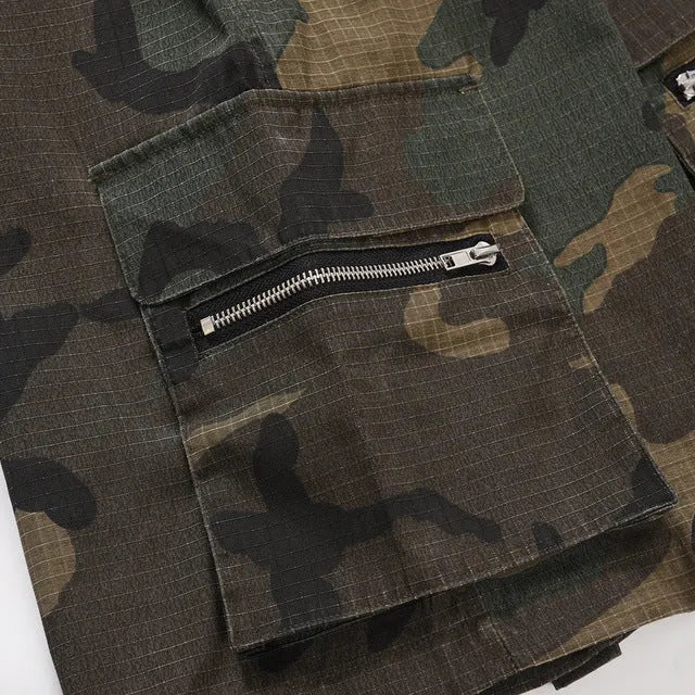 Men's green washed camouflage cotton workwear shorts with a loose fit on a mid-waist.