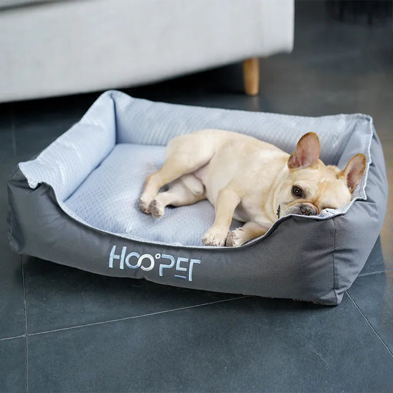 Soft grey dog bed with removable cover in small, medium, and large sizes.