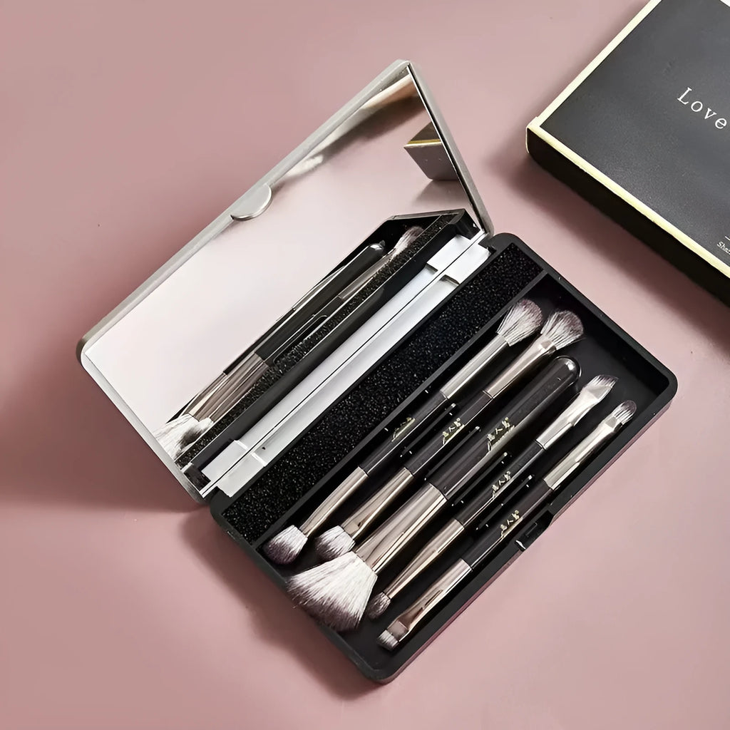 Makeup brush set with mirror showing artificial fibre bristles and plastic handles