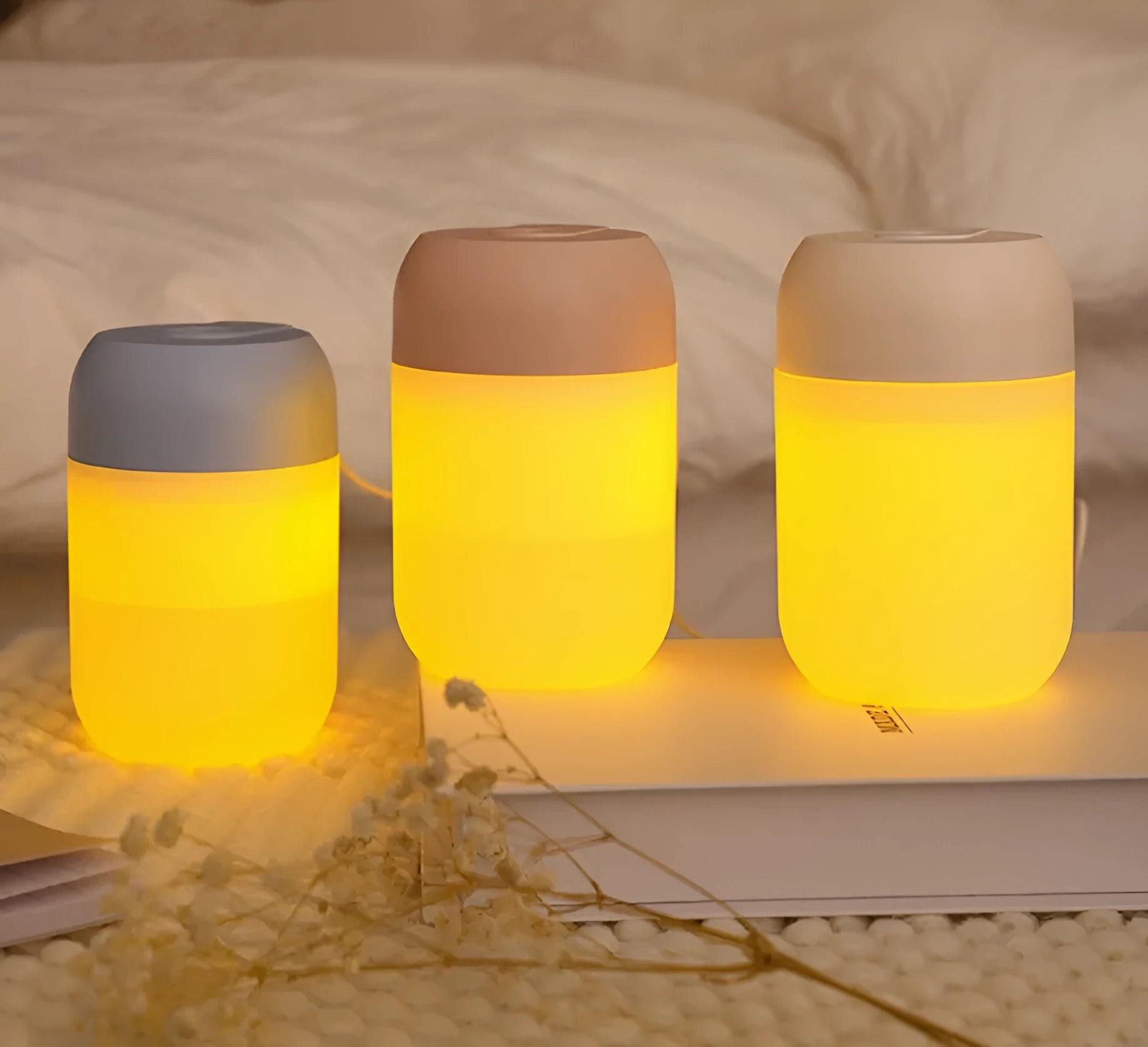 White cylindrical USB mini humidifier with charging cable