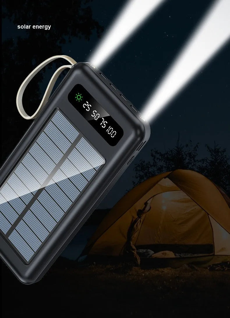 Black or white solar power bank showing the solar panel and USB ports, with a multi-purpose charging cable.