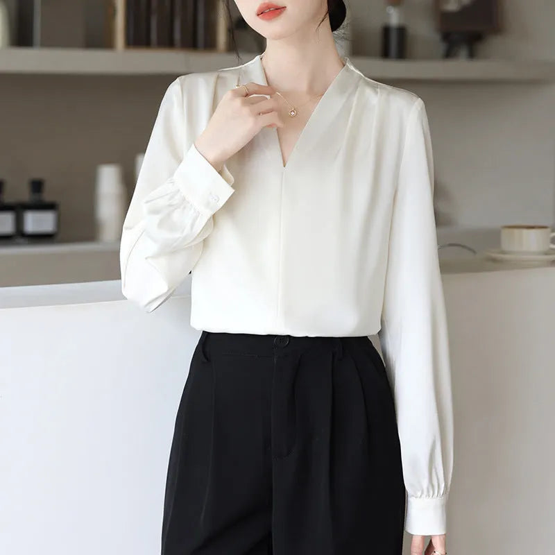 Blue slim fit long sleeve women's satin shirt with 3D stitching on a hanger.
