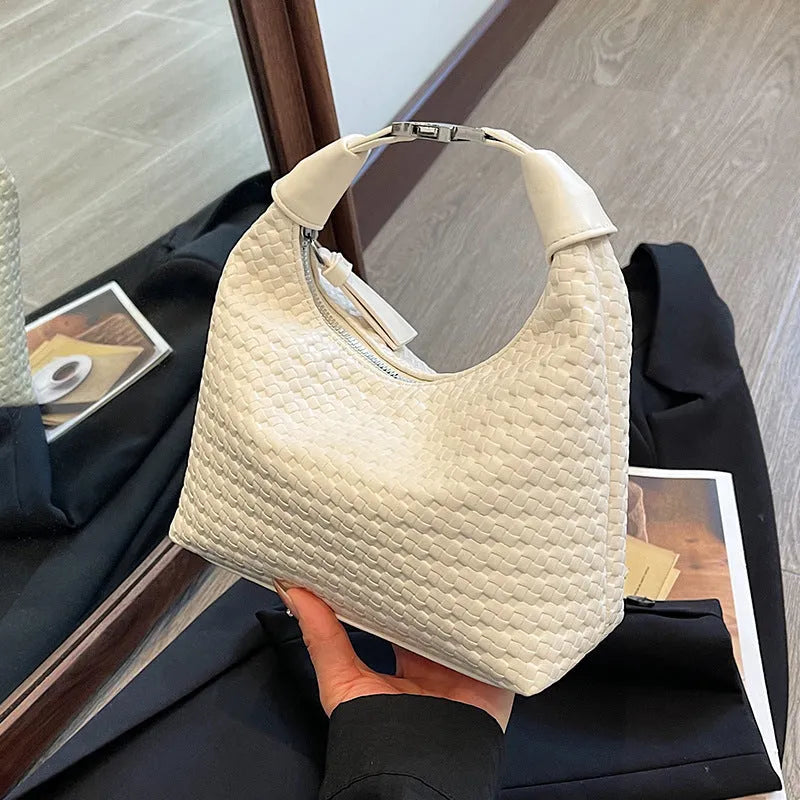 Soft PU leather bucket-style messenger bag in beige with a front sandwich pocket and shoulder strap.