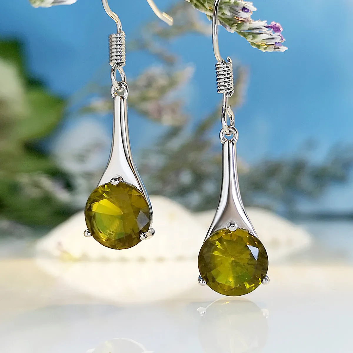 Olive green retro-style drop earrings with a minimalist water drop shape on a white background.
