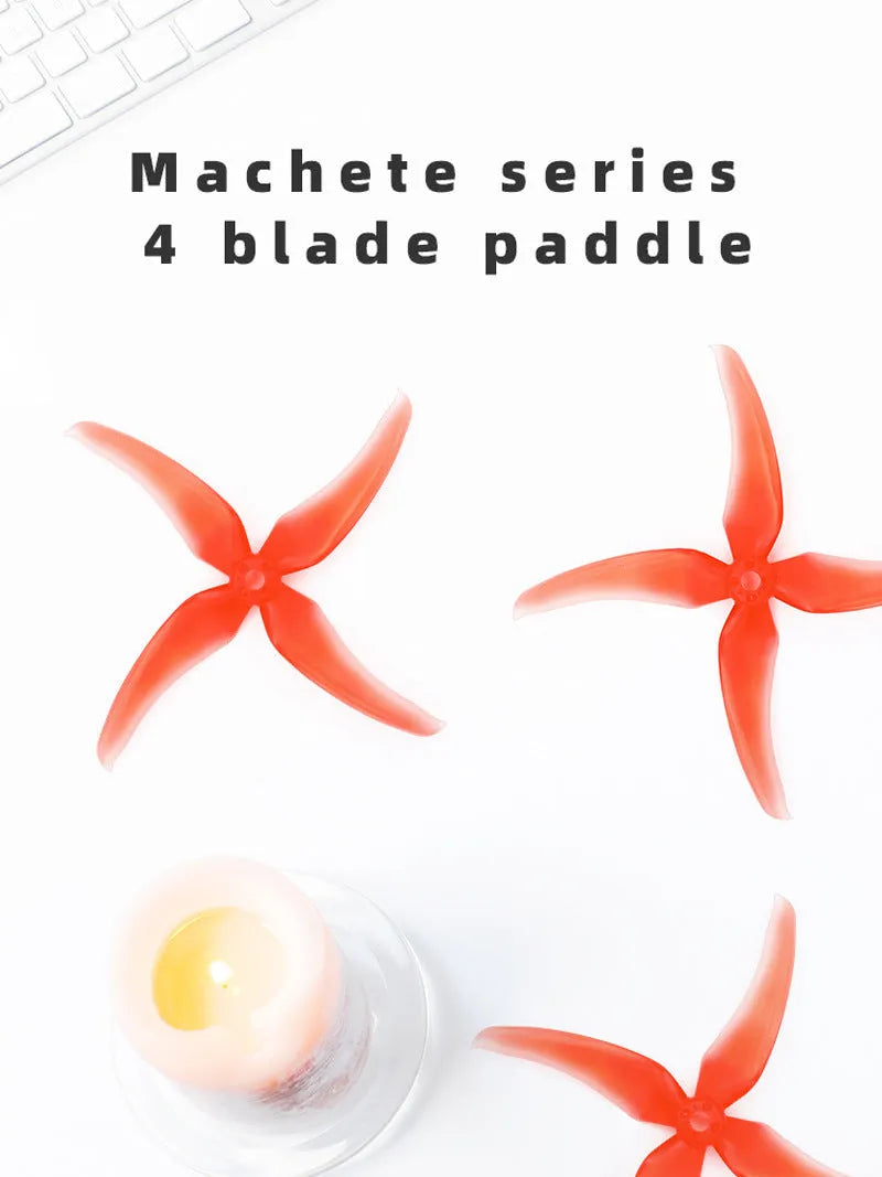 Red 5-inch crossing machine propeller with four plastic blades, shown as part of a two-pair set