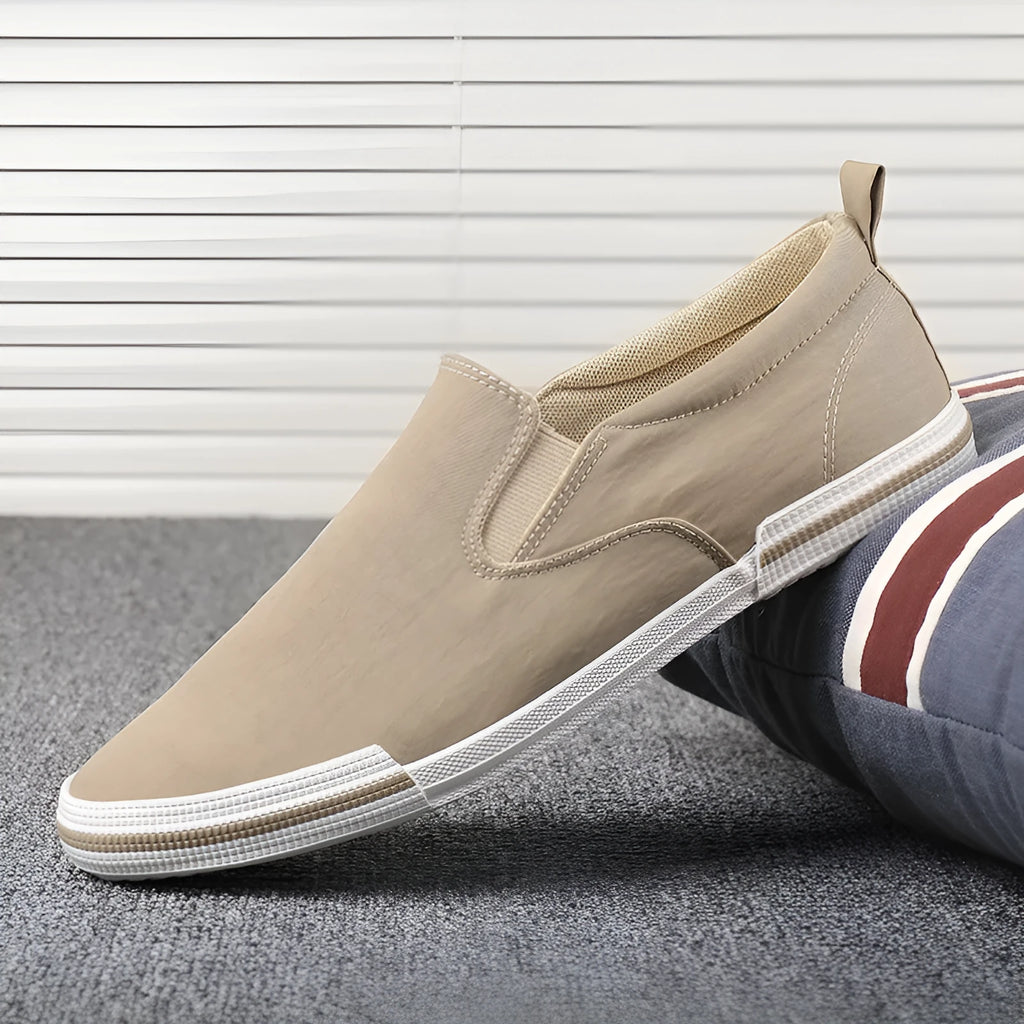 Men's low-top canvas sneakers in grey, black orange, and khaki colours with round toe and vulcanised rubber soles