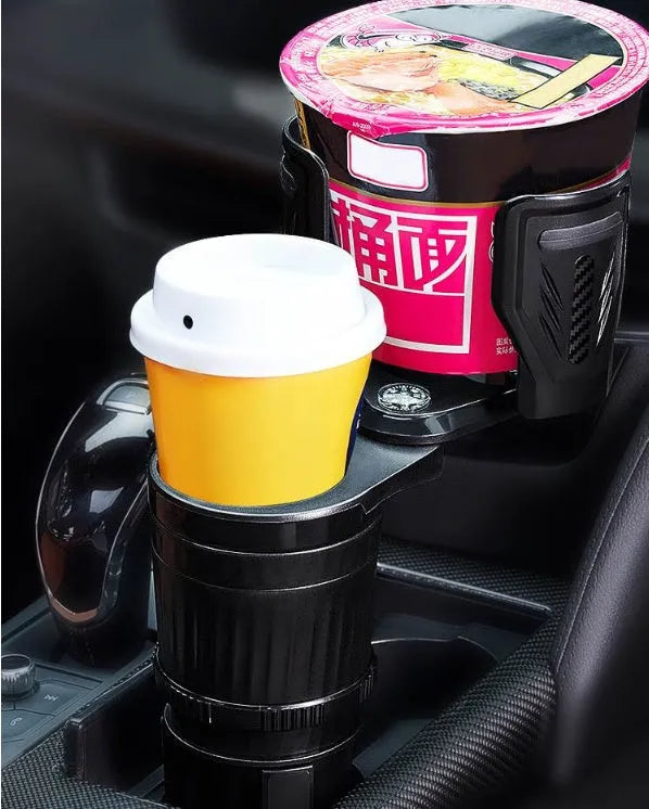 Black adjustable rotating car drink holder with retractable base on a car dashboard.