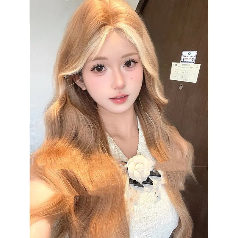 Long curly lace front wig in American highlight gold colour on display stand
