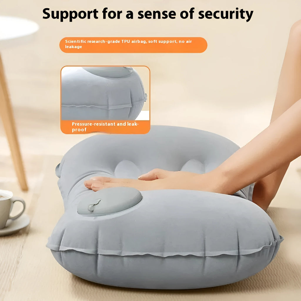 Grey inflatable travel pillow with flocking finish shown inflated to 45x30x13cm dimensions for neck support