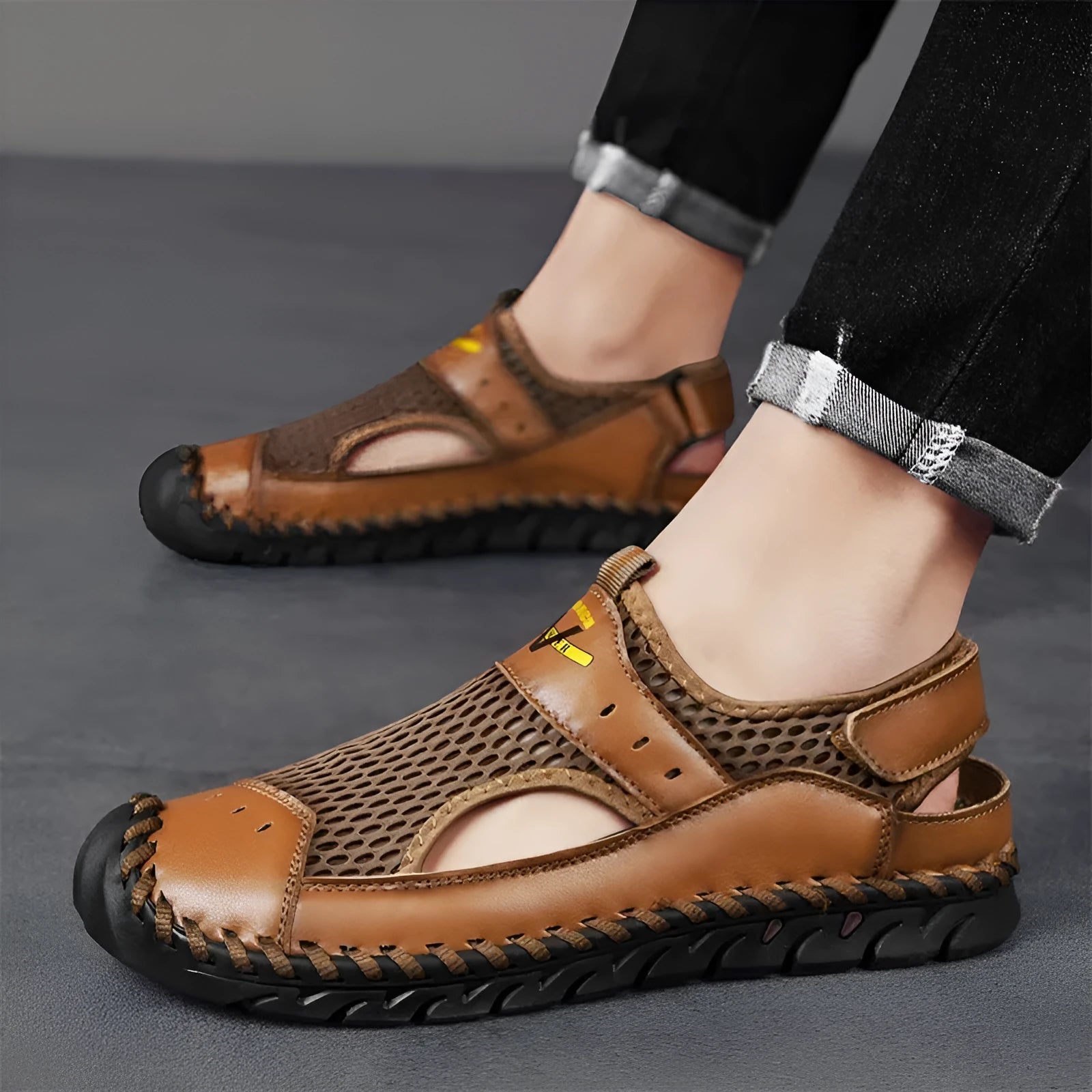 Men's black leather low-top pumps with mesh panels and an elastic band closure.