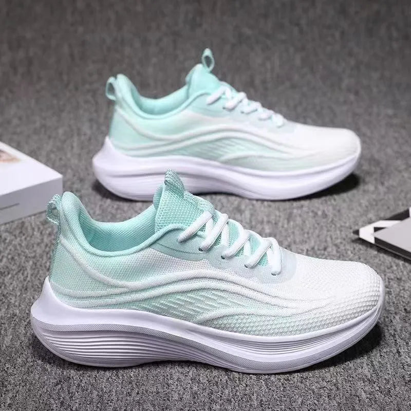 Women's lightweight running shoes with breathable mesh upper, flat heel, and front lace-up closure