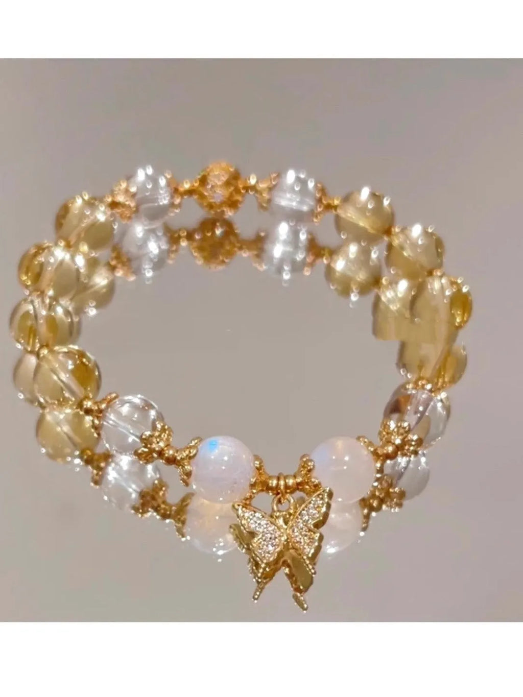 Women's Moonstone White crystal bracelet with diamond-shaped beads and a butterfly charm in Chinese style.