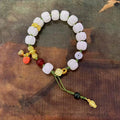 Hand-woven white jade bodhi bracelet showing pumpkin and lotus beads on adjustable open rope