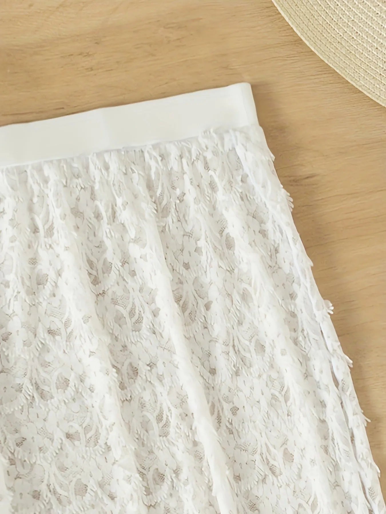 White three-piece swimsuit set with long gathered skirt, sleeveless top, and matching pants for swimming