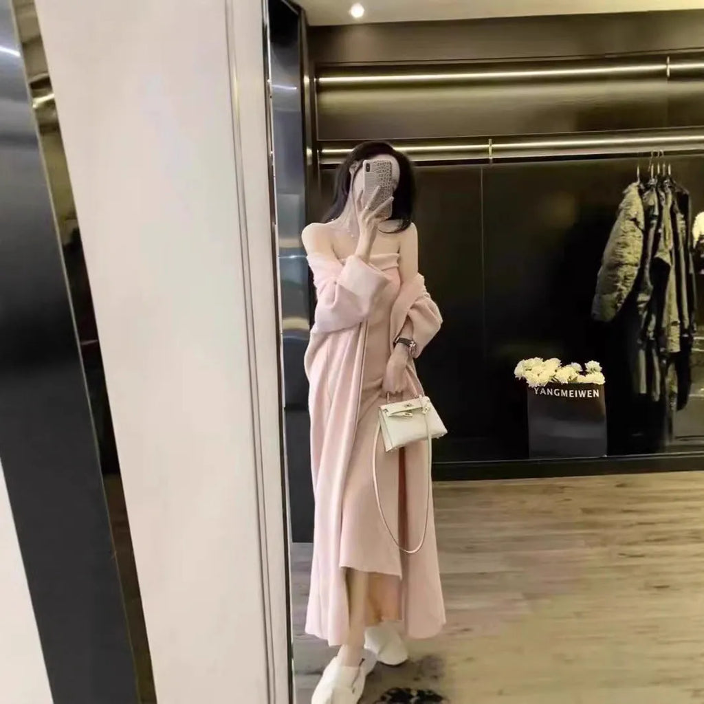 Women's grey knitted cardigan and dress two-piece suit set on a hanger.