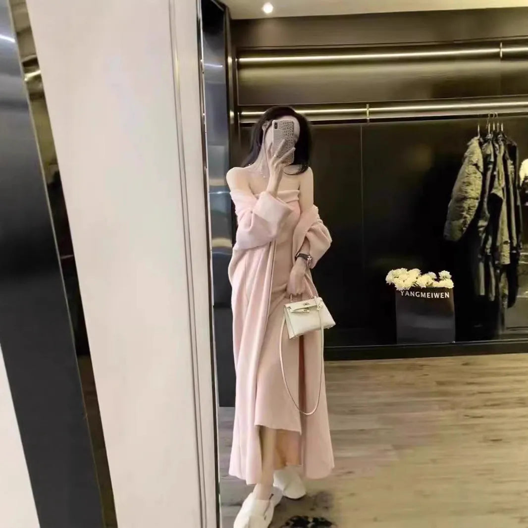 Women's grey knitted cardigan and dress two-piece suit set on a hanger.