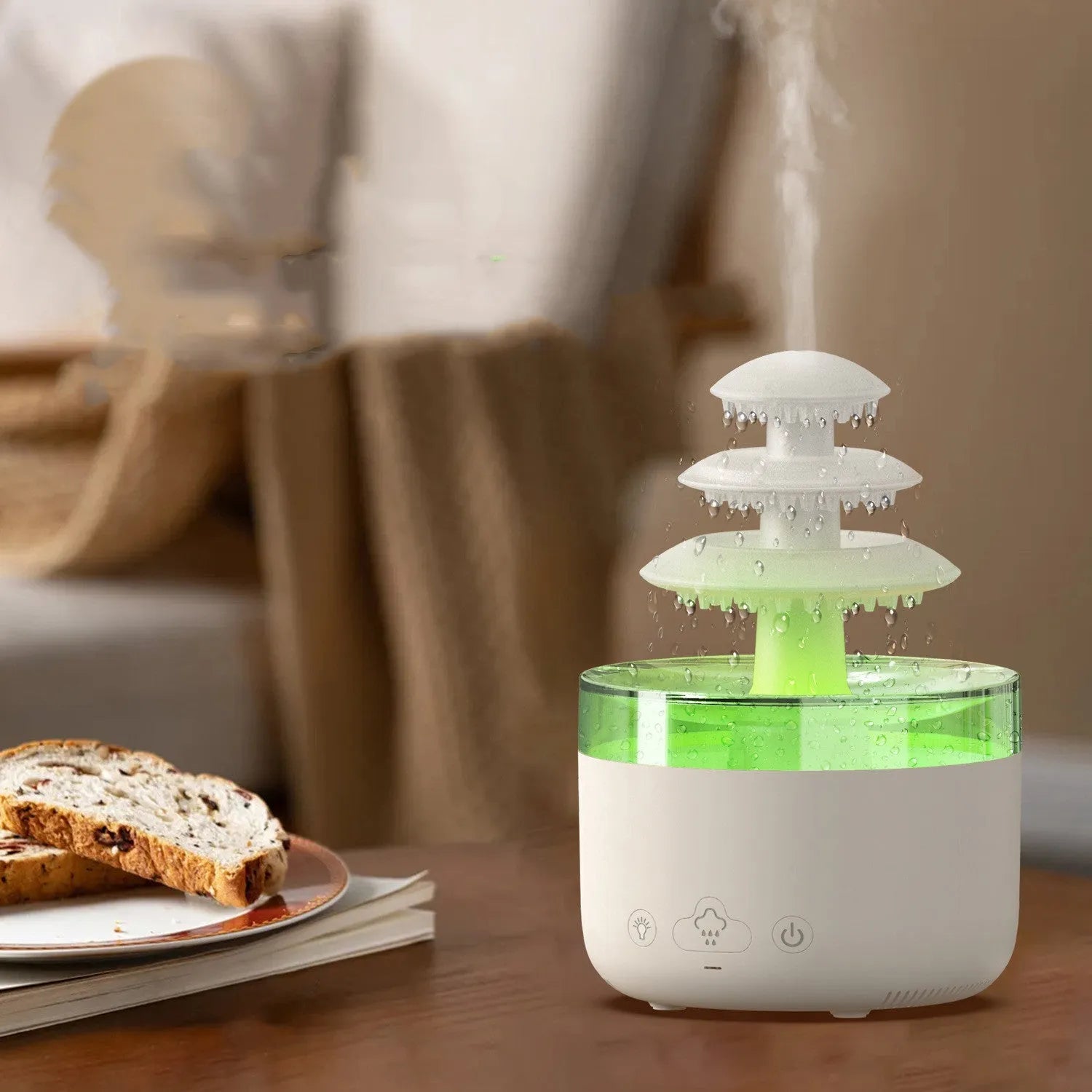 White cloud rain humidifier and essential oil diffuser with LED mood lighting on table