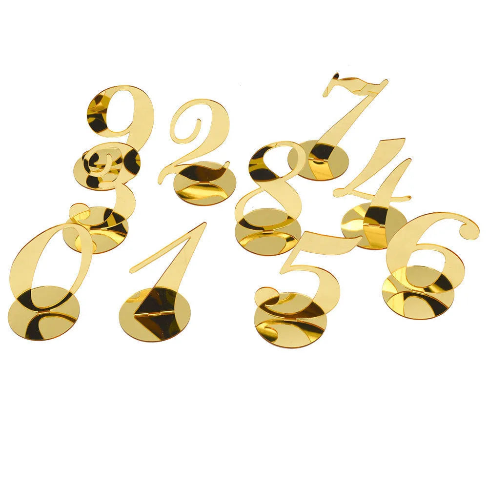 Clear acrylic table number holder with gold base displaying number 1 on a table