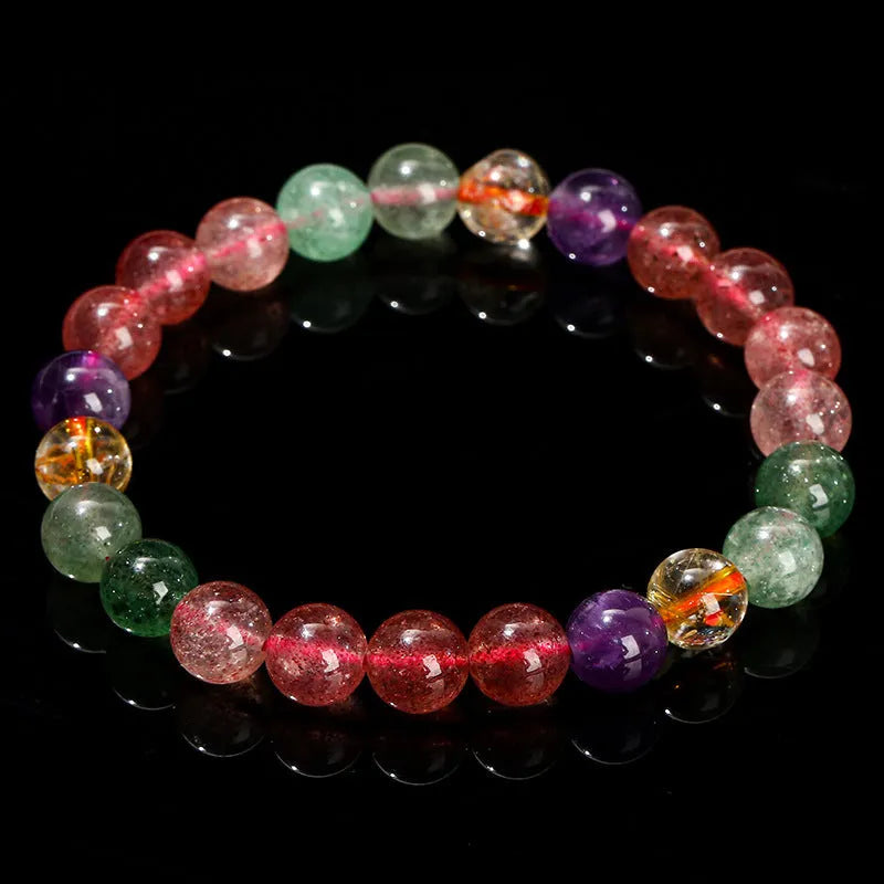 Women's strawberry quartz gemstone bracelet with round beads in a geometric pattern.