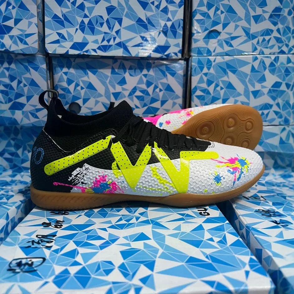 Men's low top football boots with replaceable spikes in black and yellow colourway
