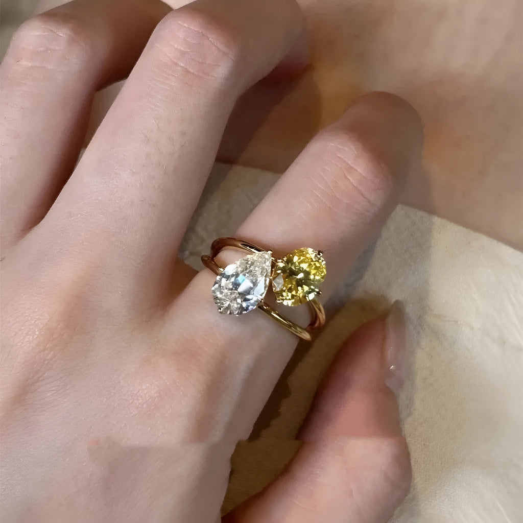 Women's copper geometric open ring with a water drop double sheng stone in a contrast colour design.