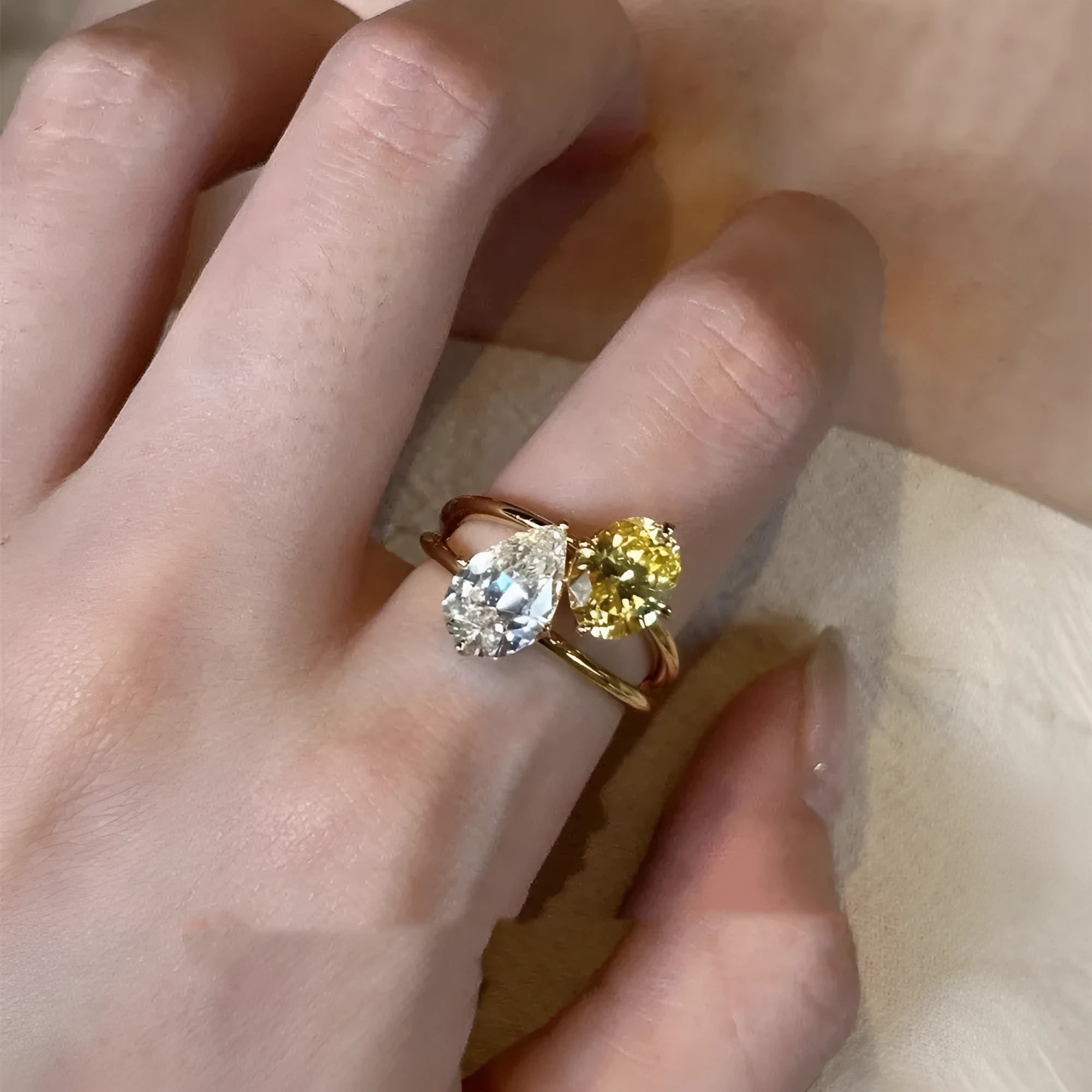 Women's copper geometric open ring with a water drop double sheng stone in a contrast colour design.