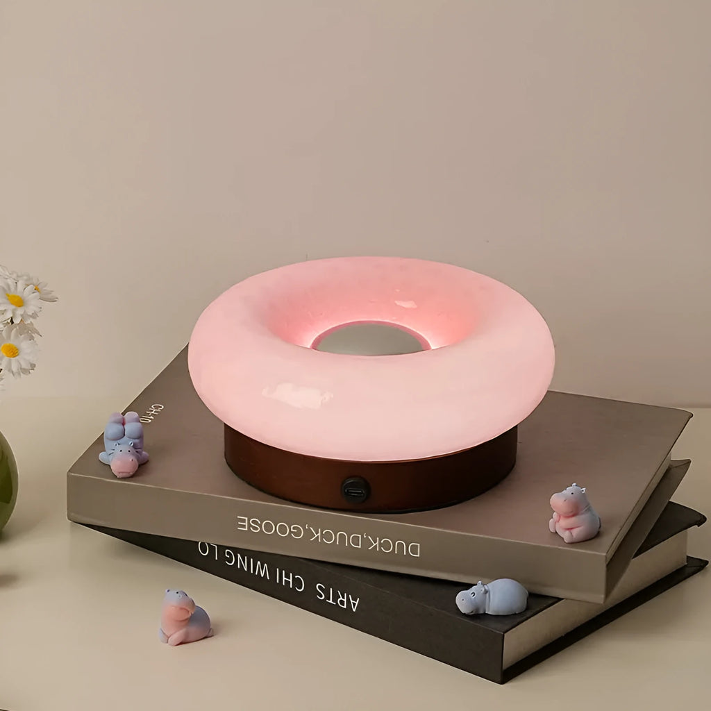 Rechargeable donut touch table lamp in custard, green, orange, or pink with three colour modes and charging cable