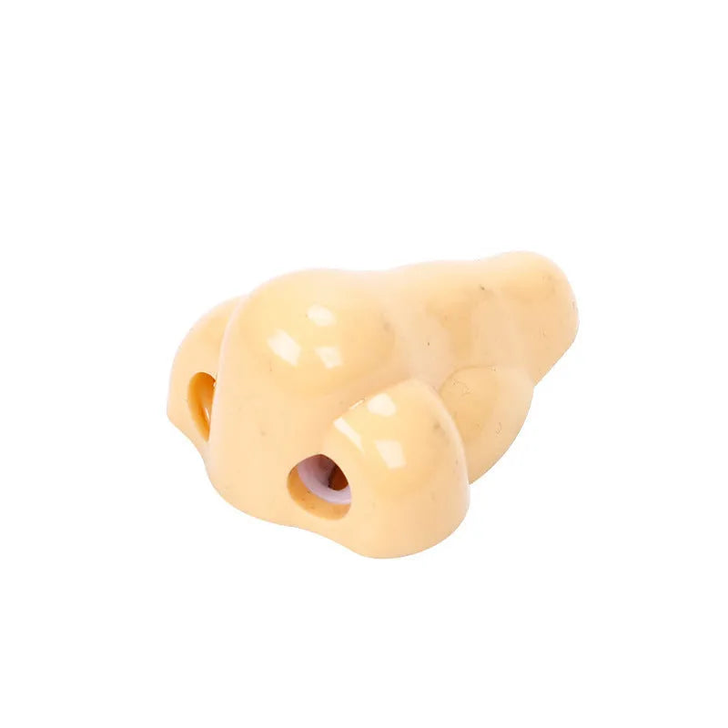 Flesh colour plastic manual pencil sharpener with geometry shape measuring 58x45x30mm
