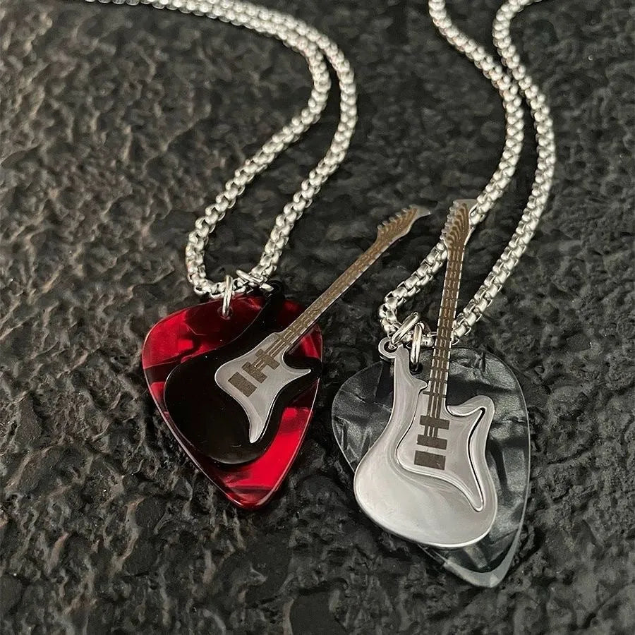 Black guitar pendant necklace in titanium steel on box chain, lithographic finish, women's punk rock style accessory.