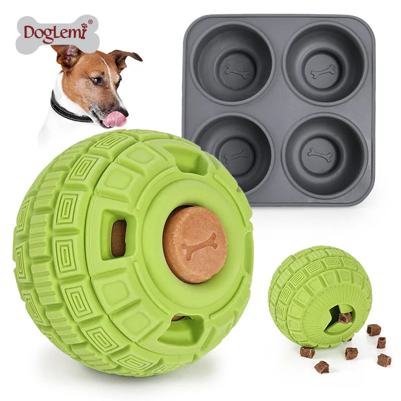 Green natural rubber food dropping ball dog toy for treat dispensing on a white background.
