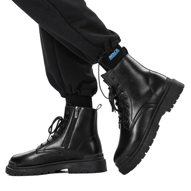 Men's black leather-look mid-top boots with a flat rubber sole on a neutral background