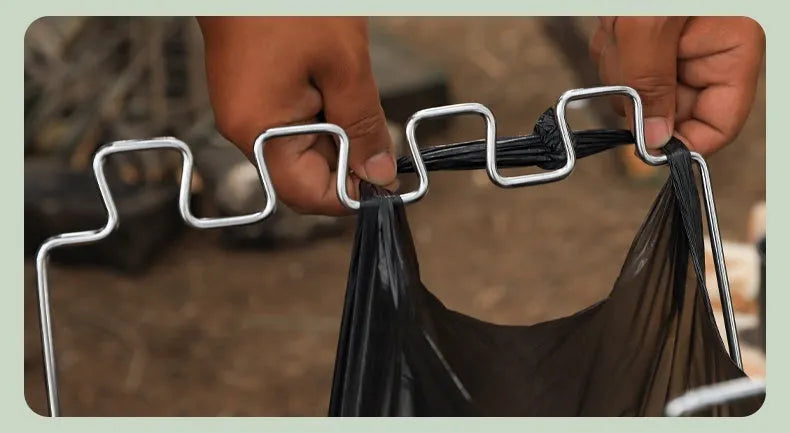 Silver folding garbage bag bracket made from stainless steel for camping and household waste management