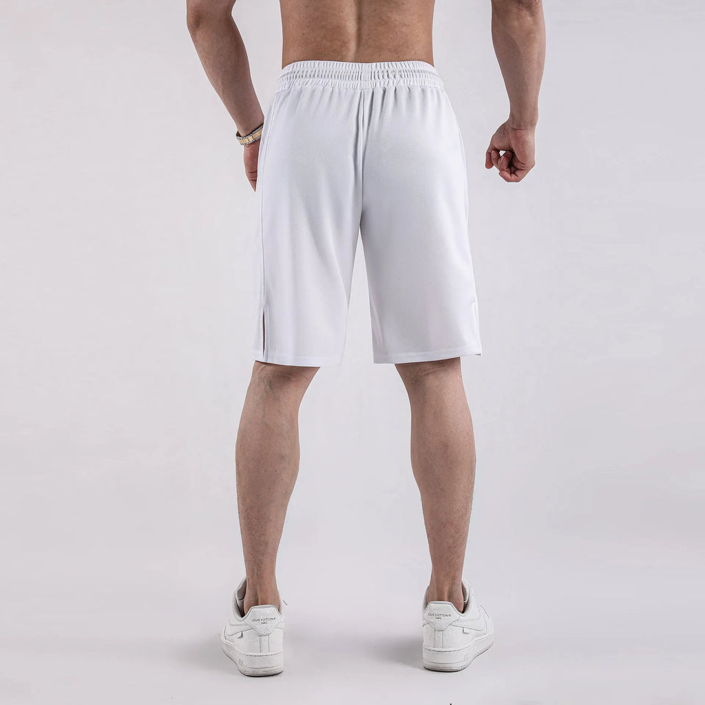 Man wearing black loose-fit quick-dry mesh shorts with an elasticated waistband.