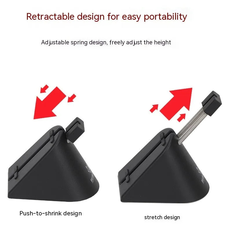 Black ABS plastic cable bracket holding a wired mouse cord on a desk