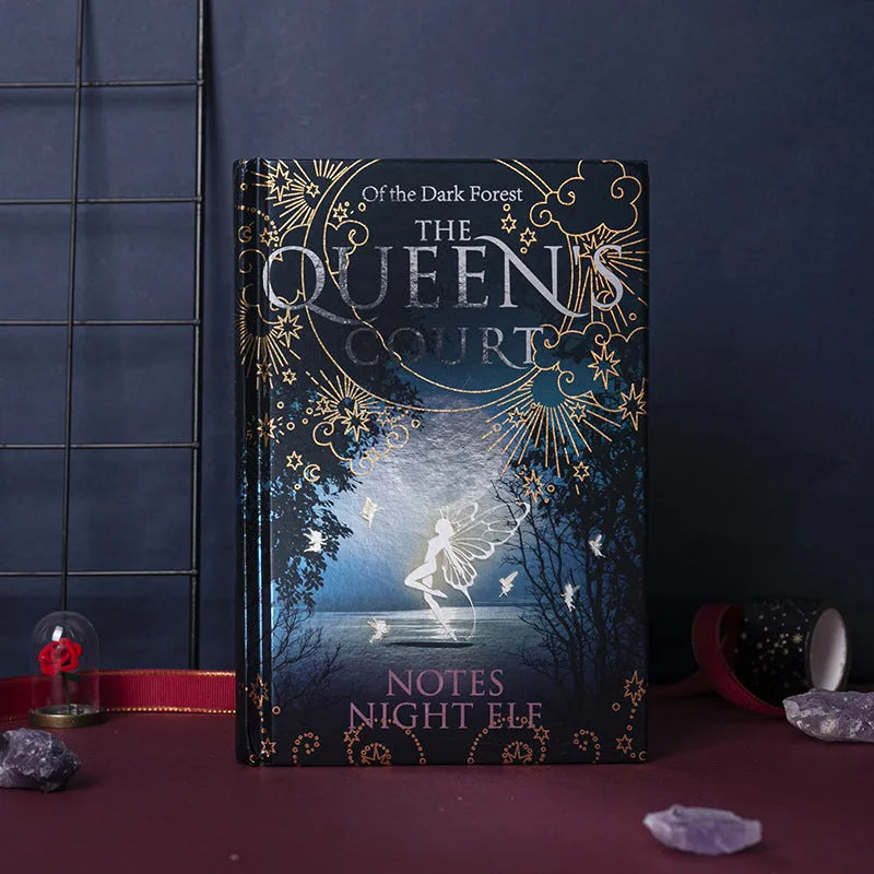 Blue A5 hardcover notebook with luminous fluorescent cover, open to show full-colour illustrated pages.