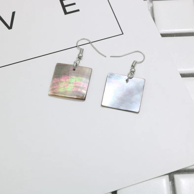 Geometric shell earrings in square panther or rectangular shell designs with natural finish