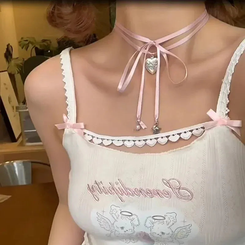 Women's alloy fashion necklace with a detailed ribbon and love pendant design on a clavicle chain, shown in one of 33 colour options.