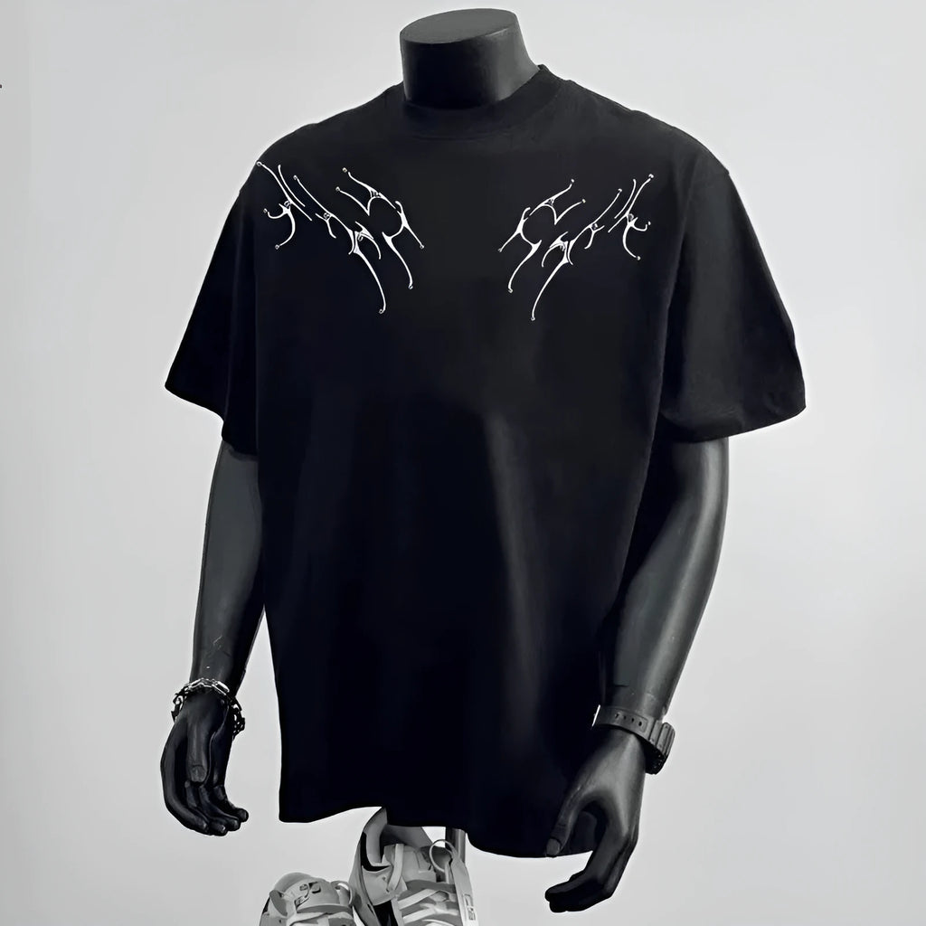 Man wearing a black loose-fit pure cotton short sleeve t-shirt with a printed design.
