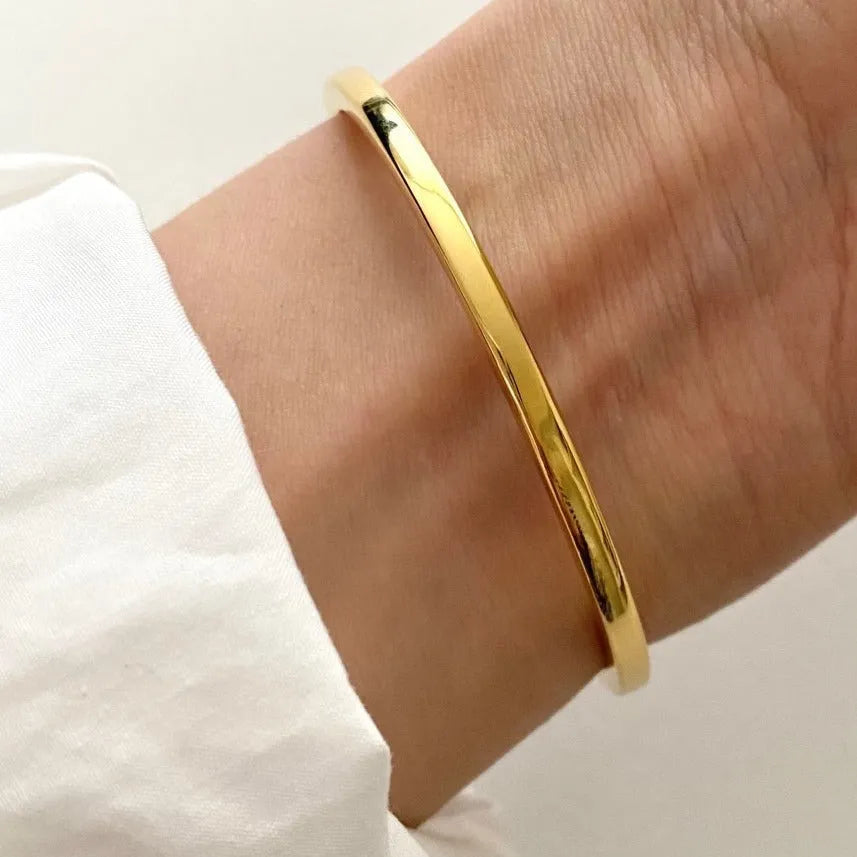 Sterling silver 3mm square line bracelet with electroplated finish on white background