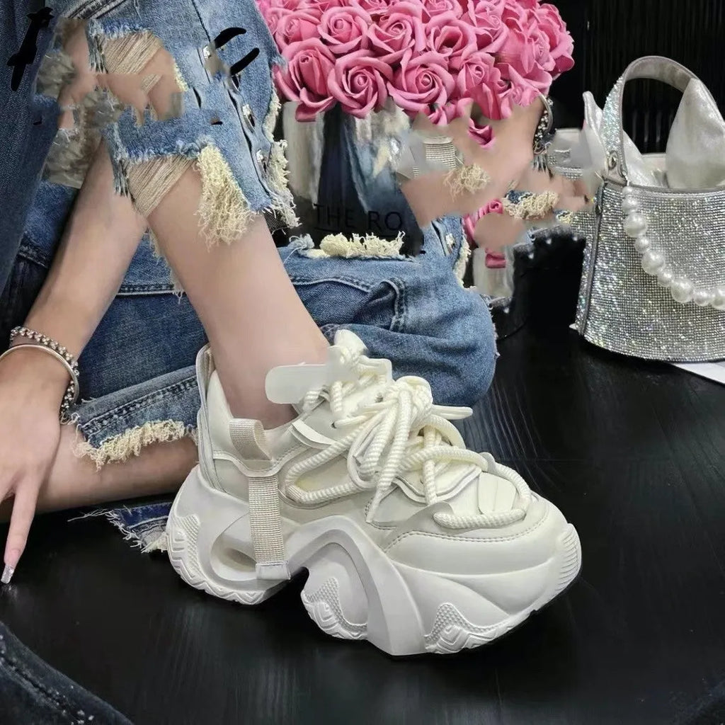 Women's casual wedge sneakers with cross-straps in creamy white colour