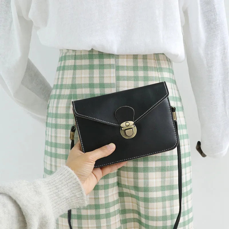 Retro soft surface messenger bag with lock closure showing wine red colour option