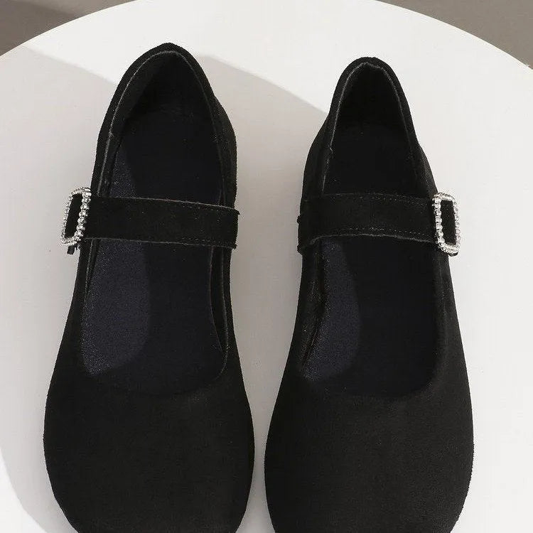 Black canvas fisherman shoes with rubber sole showing low-top design