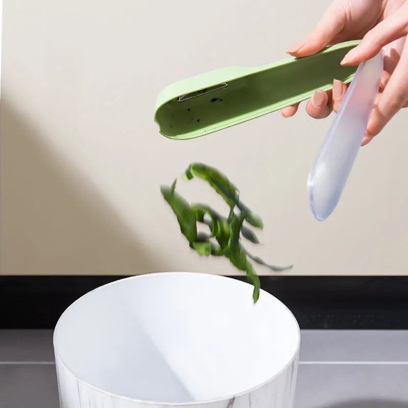 Green fruit and vegetable peeler with a stainless steel blade stored inside its own plastic tube.